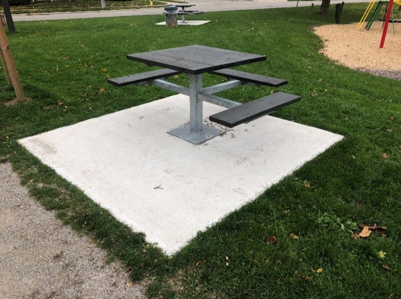 Square table with seating and one side with no seating to accommodate accessiblity