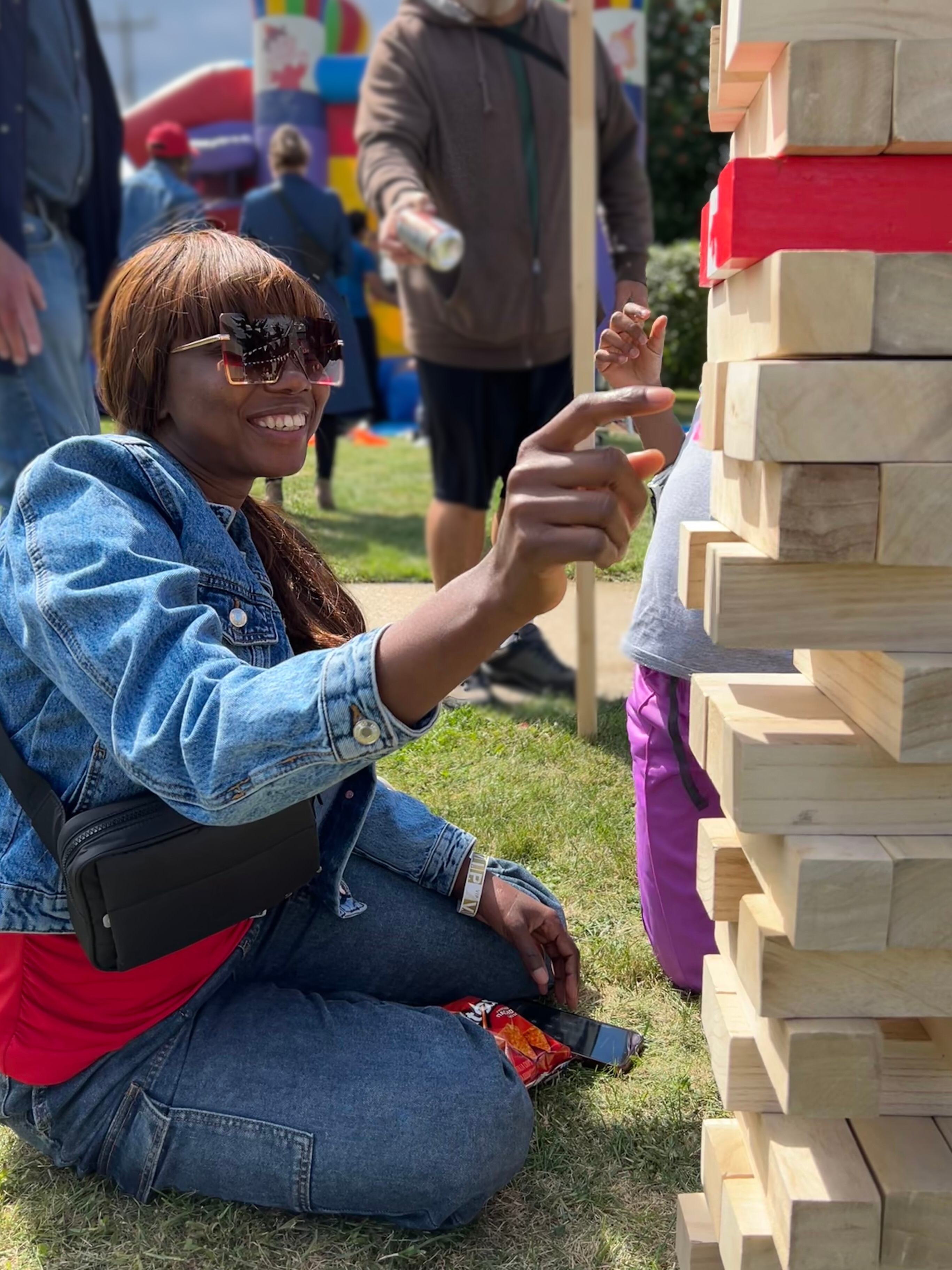 woman playing giant jenga