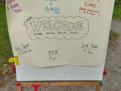  a hand drawn welcome sign on a childs art easel