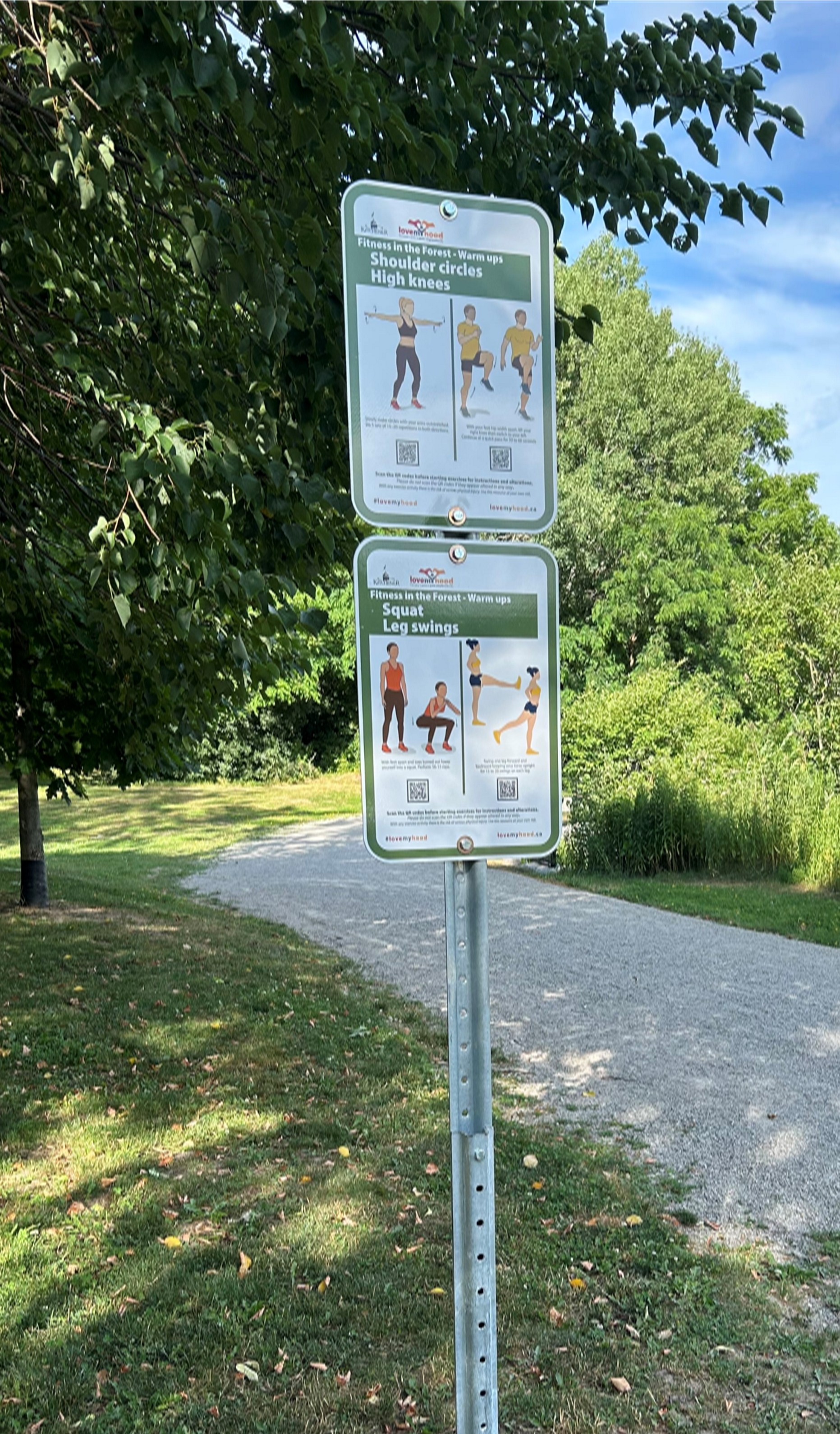 2 signs on a post showing instructions for exercises