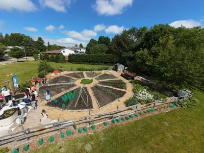 an ariel view of a garden shaped like a pioneer wagon wheel