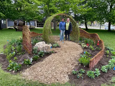 woman standing in small garden