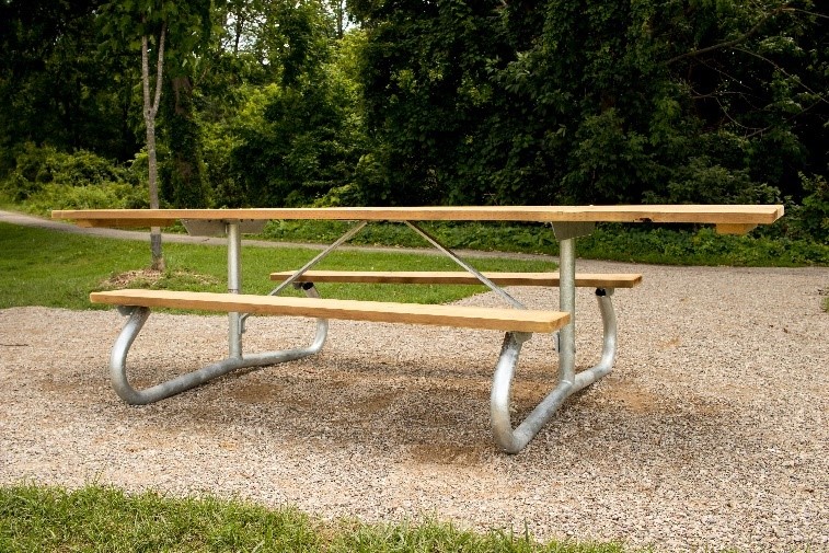 wooden picnic table with extended edge to accommodate accessibility needs